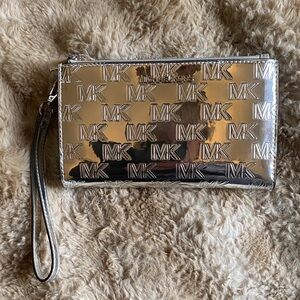 Michael Kors Metallic Silver MK Embossed Wristlet